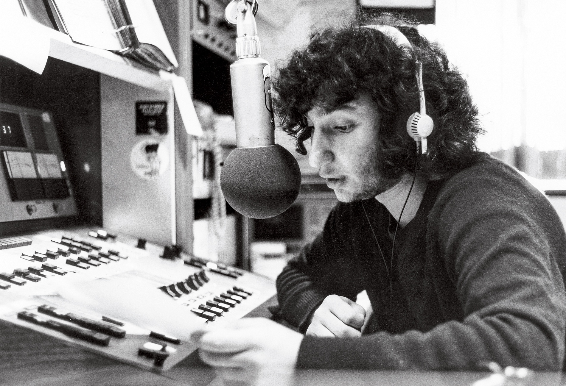 Photo of Bill Lichtenstein on the air at WBCN in 1973