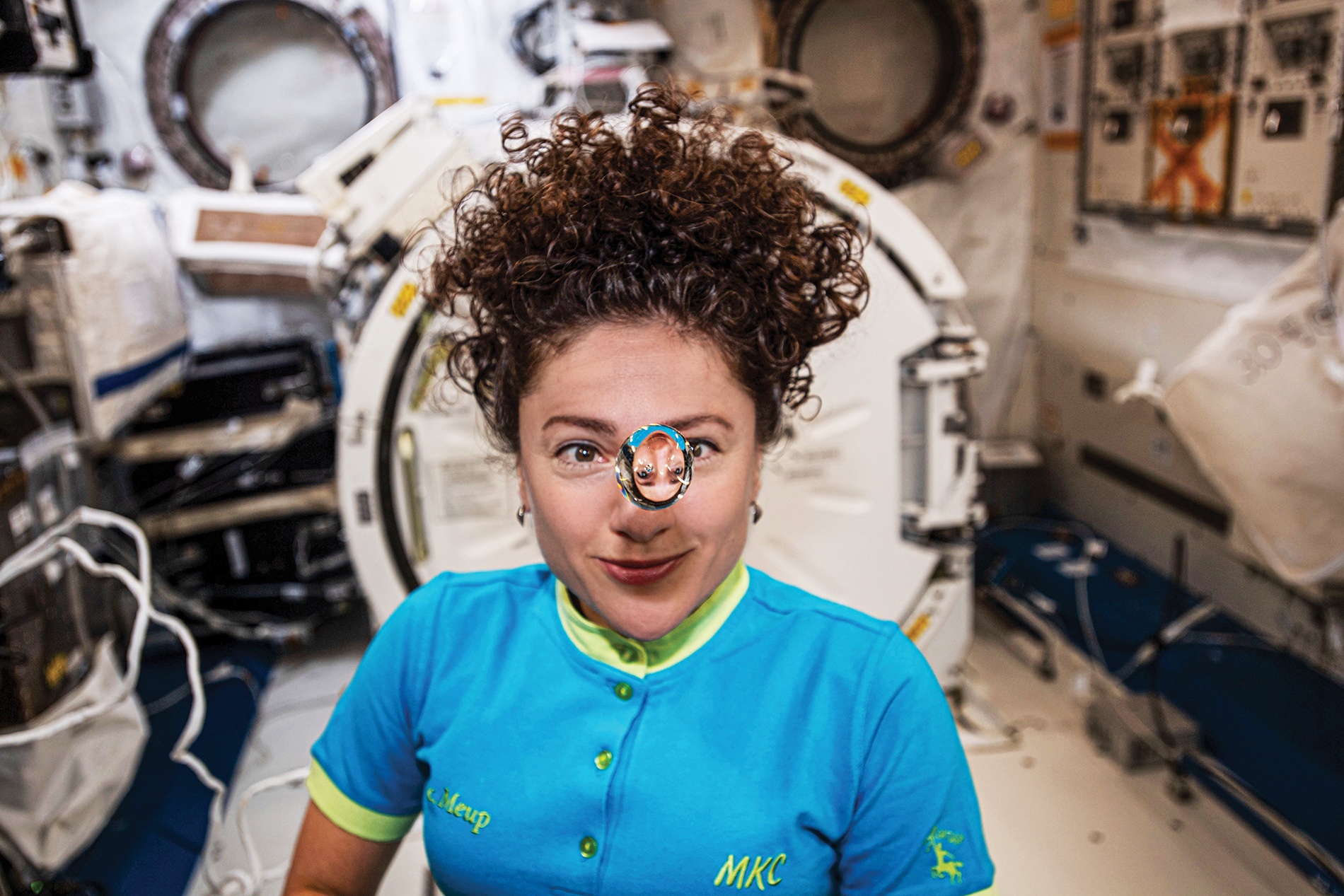 Jessica Meir ’99 plays with a water droplet in space