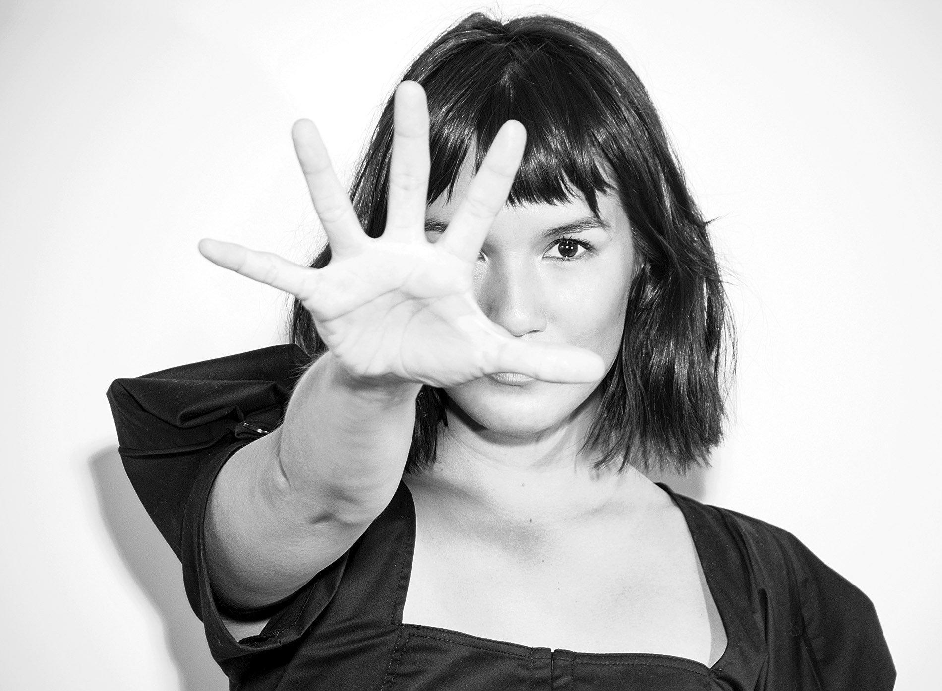 Image of Zoë Chao with her outstretch hand to the camera