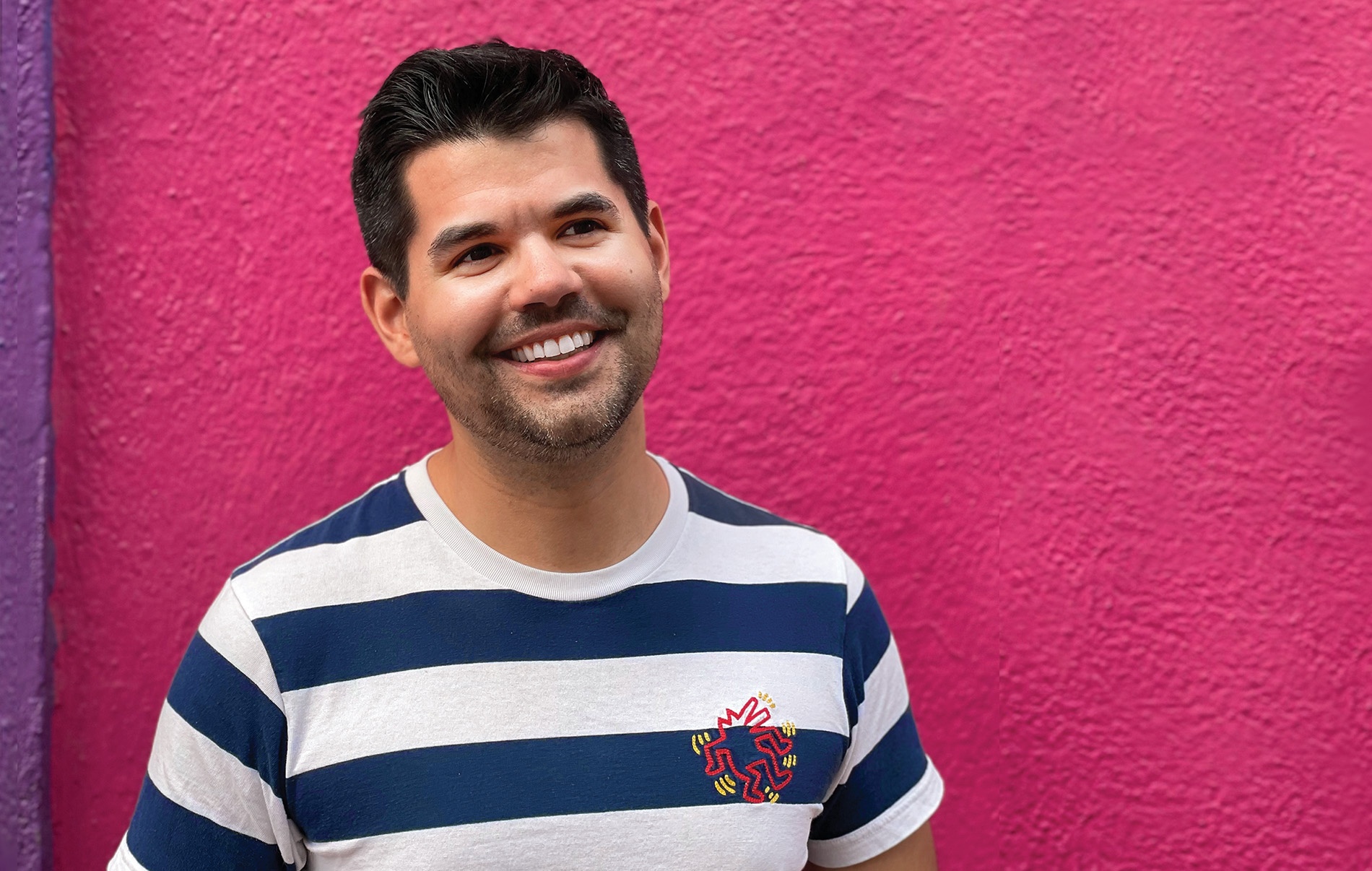 Image of Max Rosero in front of a pink concrete wall