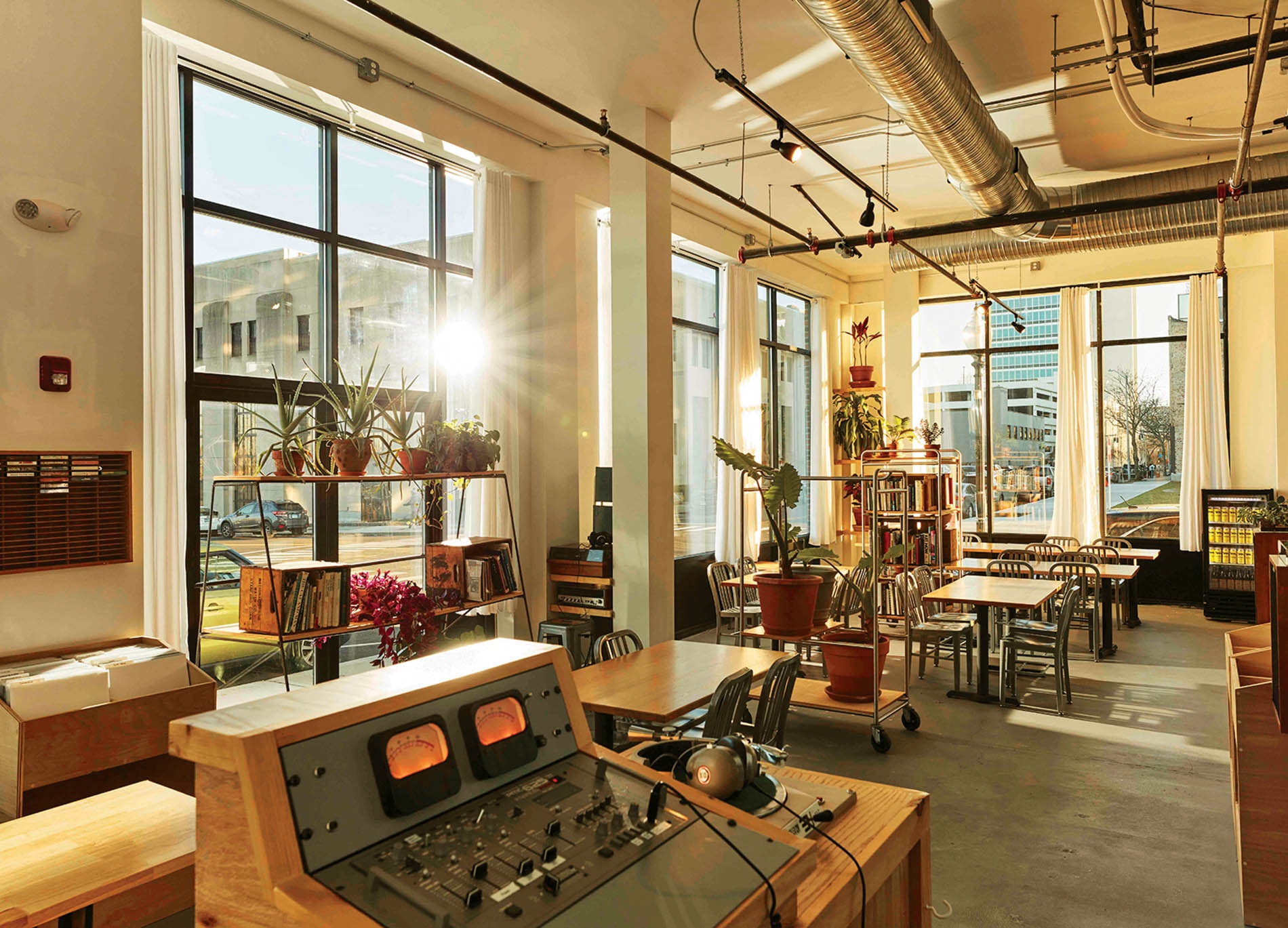 Image of the DJ booth at Berlinetta Brewing in the foreground and the restaurant in the background