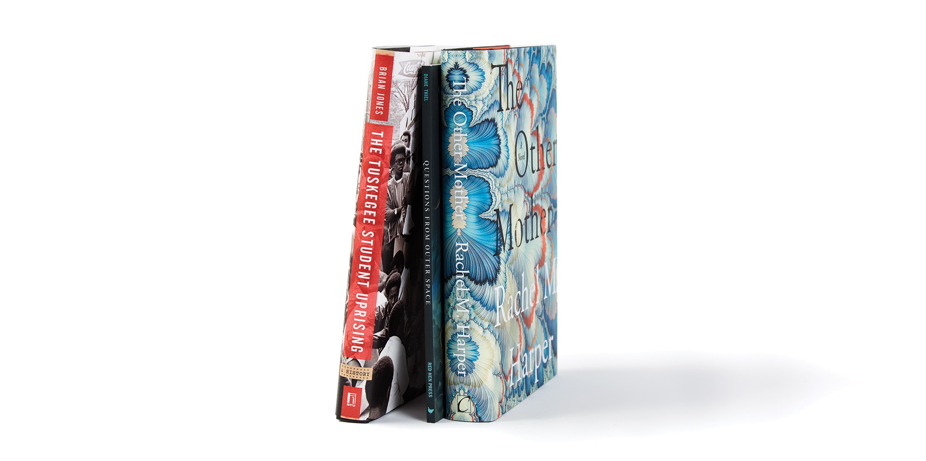 Image of the spines of books by Brian Jones ’95, Diane Thiel ’88, ’90 MFA, and Rachel M. Harper ’94