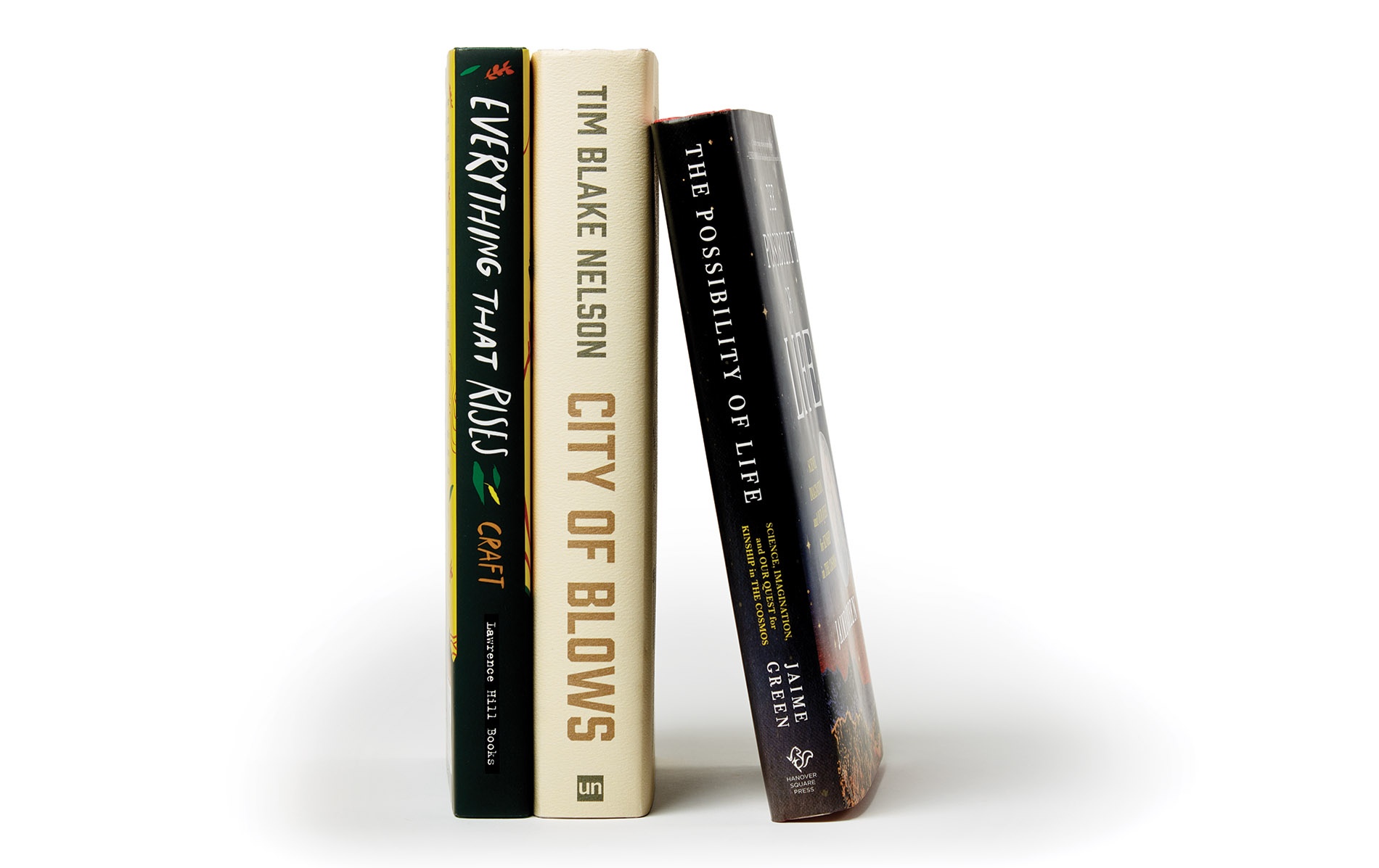 Image of book spines by Jaime Green ’04, Tim Blake Nelson ’86, and Brianna Craft ’13.