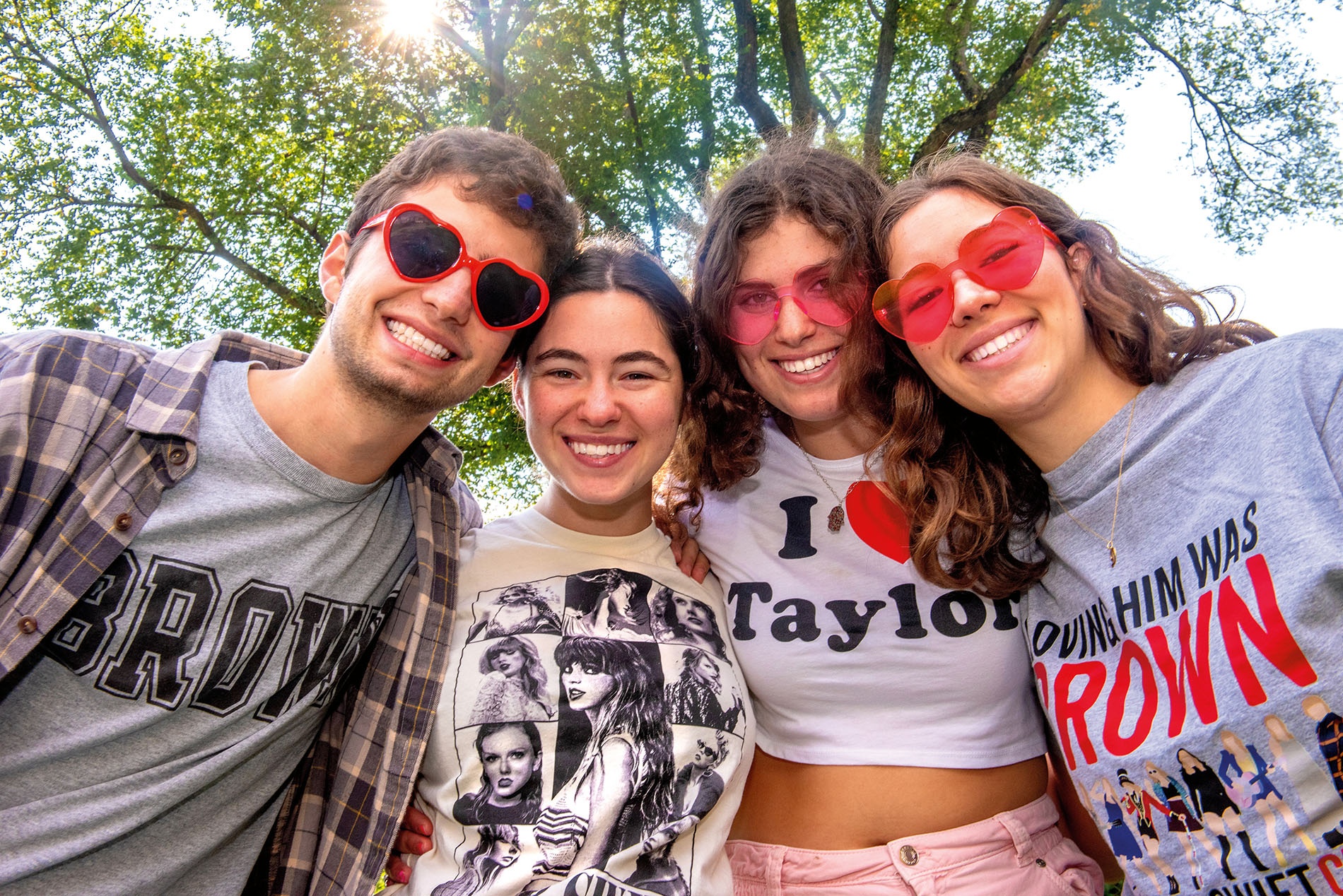 Image of Jake Stifelman, Maddie Cosgrove, Zoey Fisher, and Danielle Costa in a huddle looking at the camera.