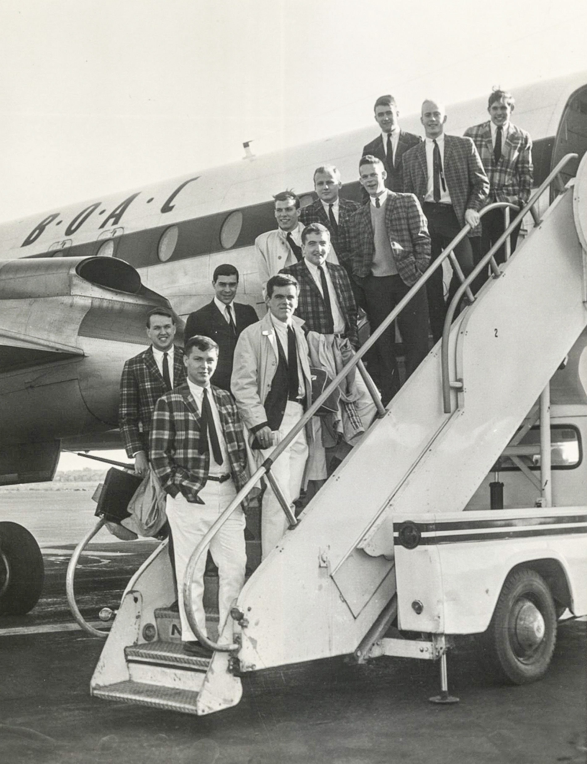 Archival image of the Jabberwocks boarding a plane in 1963.