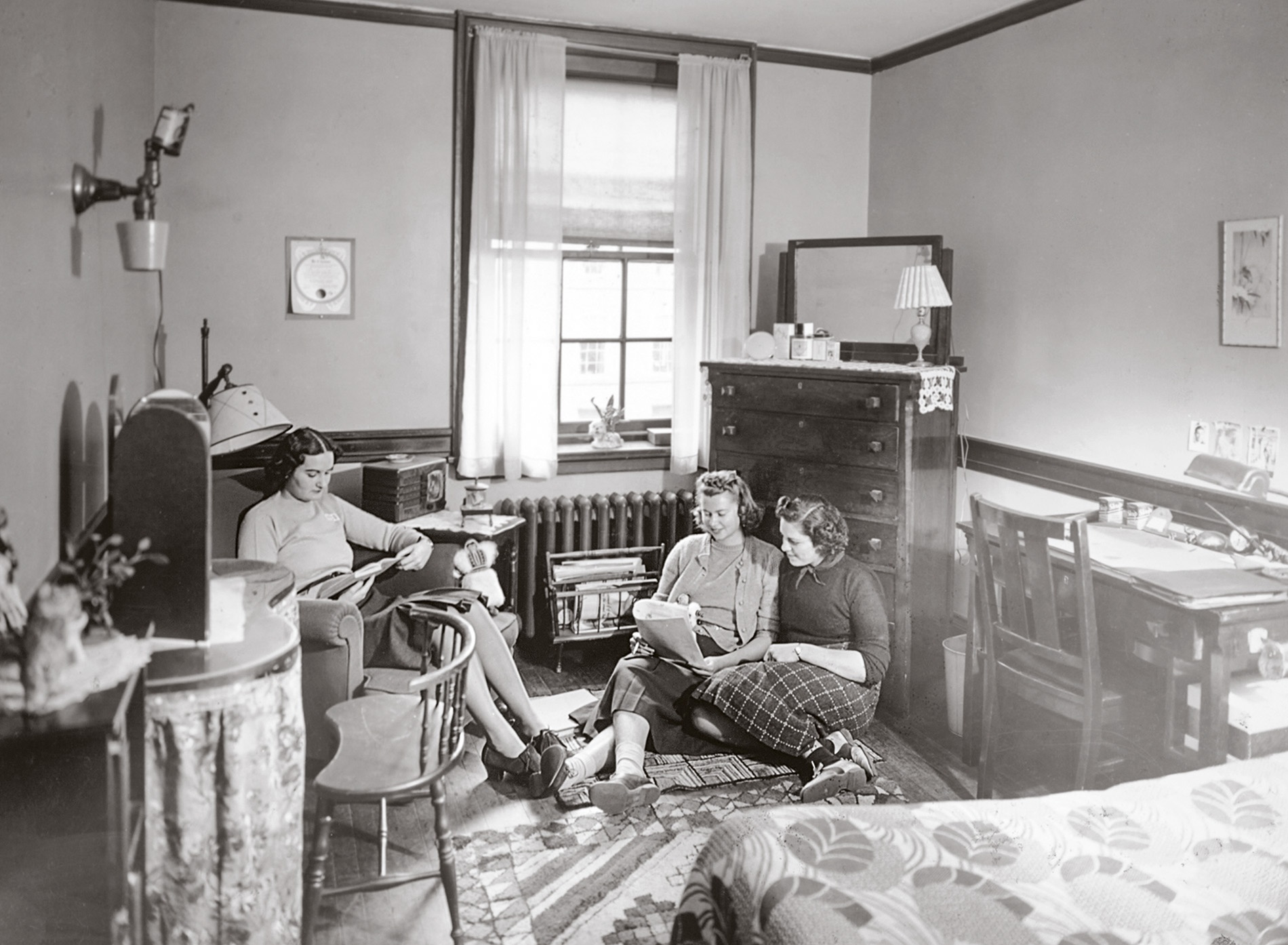Archival image of women in a dorm room in Pembroke