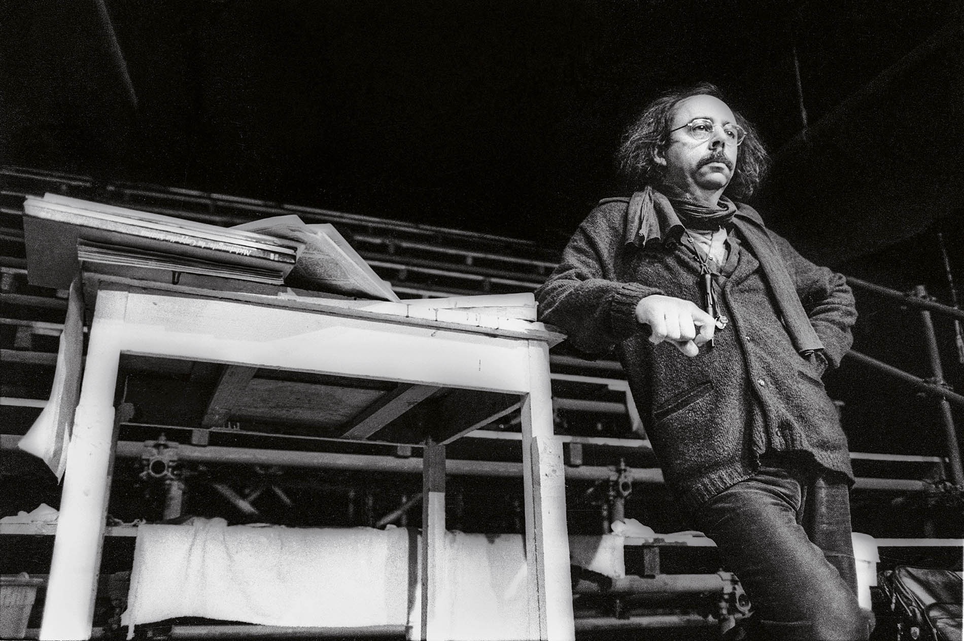 Archival image of Richard Foreman leaning on stage