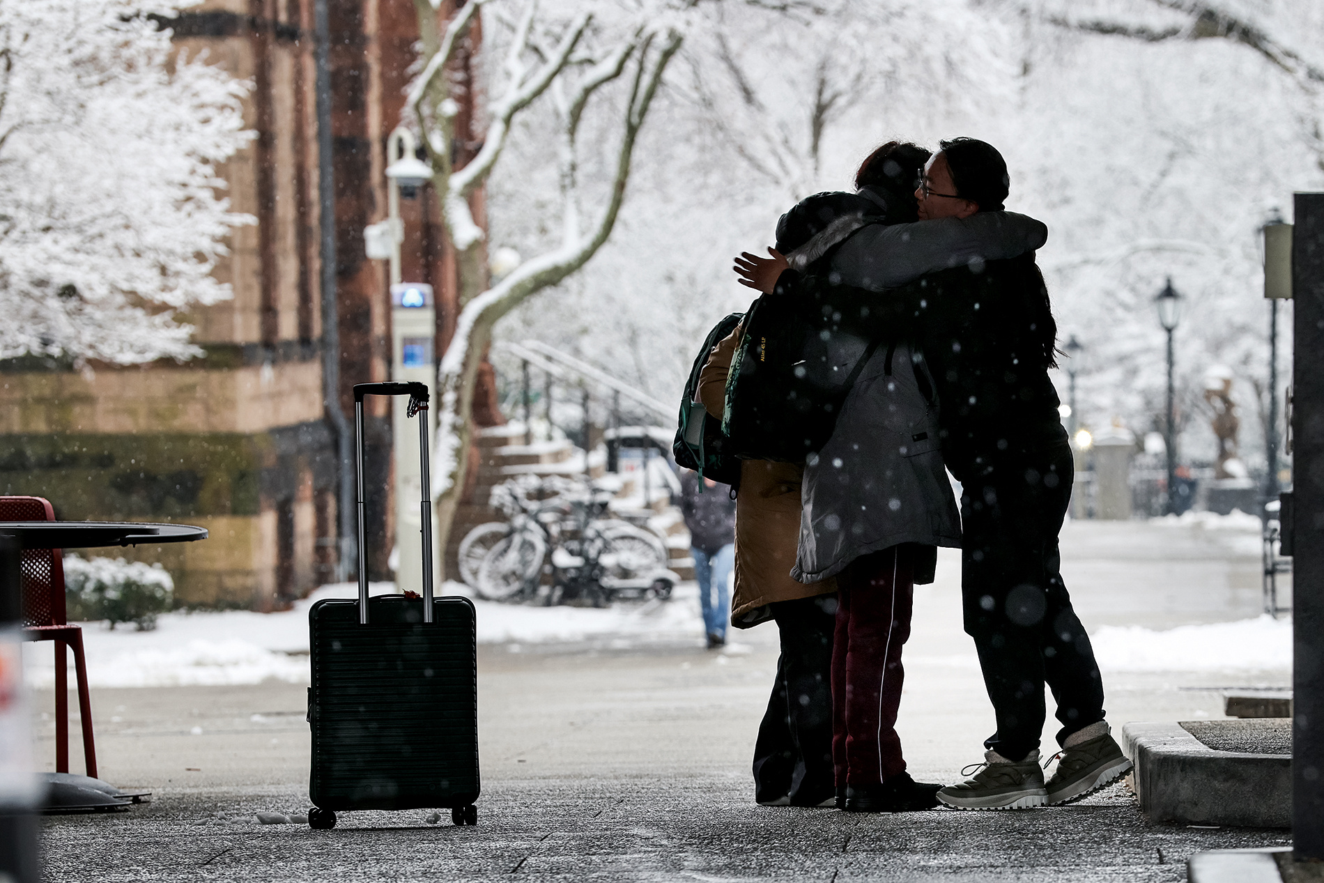 Students embrace on the main green