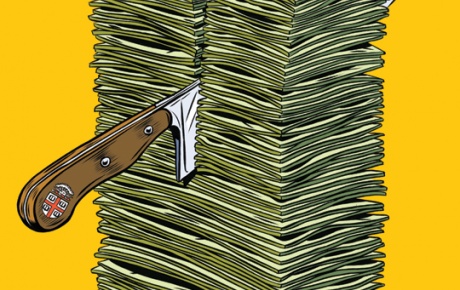 Knife cutting through a pile of money