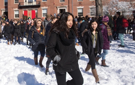 Students on the main green in the snow.