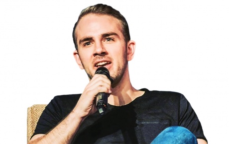 Image of Devin Finzer with microphone