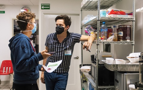 Image of Dr. Hannah Janeway and Christian Armenta at a clinic