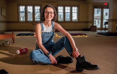 Image of Kaitlin Goldin sitting on the floor in the chapel at Hillel, Brown University
