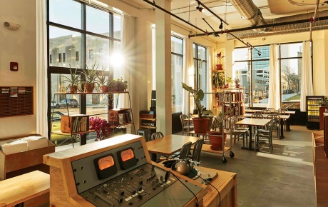 Image of the DJ booth at Berlinetta Brewing in the foreground and the restaurant in the background