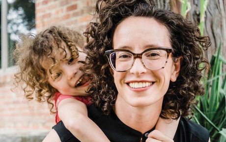 Image of Molly Birnbaum and her daughter Olive, hugging her from behind