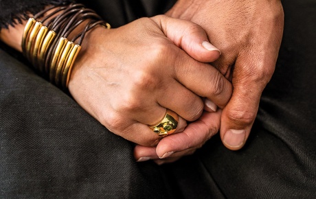 Photo of the clasped hands of Tricia Rose and Andre Willis