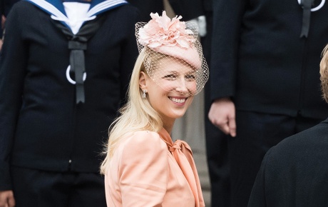 Image of Lady Gabriella Windsor dressed in pink looking back at the camera and smiling.