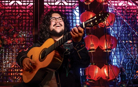 photo of Chance Emerson in a tea house, with guitar