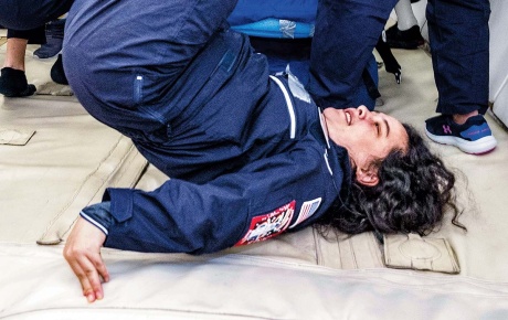 Image of Lindsay Yazzolino upside down in a zero gravity test.