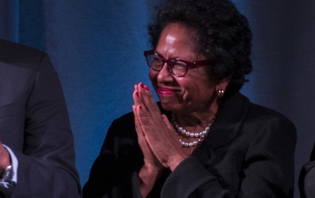 An image of Ruth Simmons clasping her hands together.