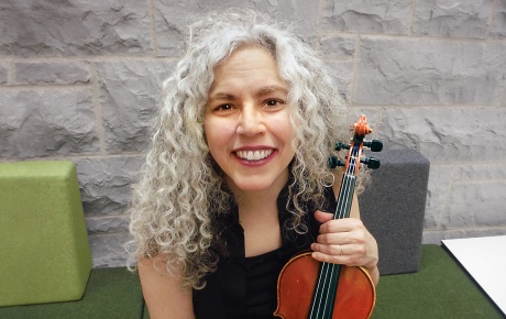 Image of Alicia Svigals holding a violin