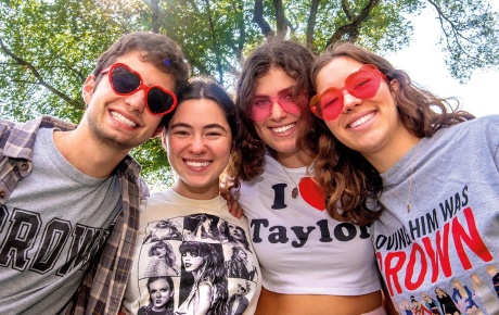 Image of Jake Stifelman, Maddie Cosgrove, Zoey Fisher, and Danielle Costa in a huddle looking at the camera.