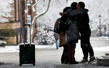 Students embrace on the main green